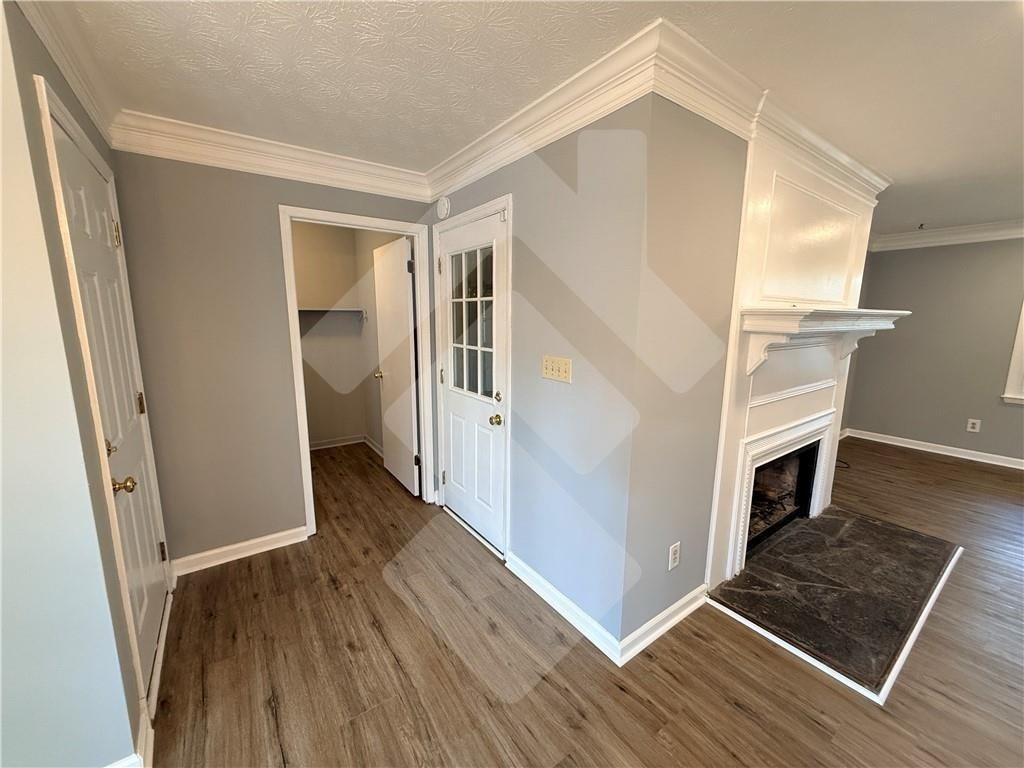 4502 Alder Lane Powder Springs, GA 30127 - Photo 14 of 64 a view of a livingroom with wooden floor and staircase