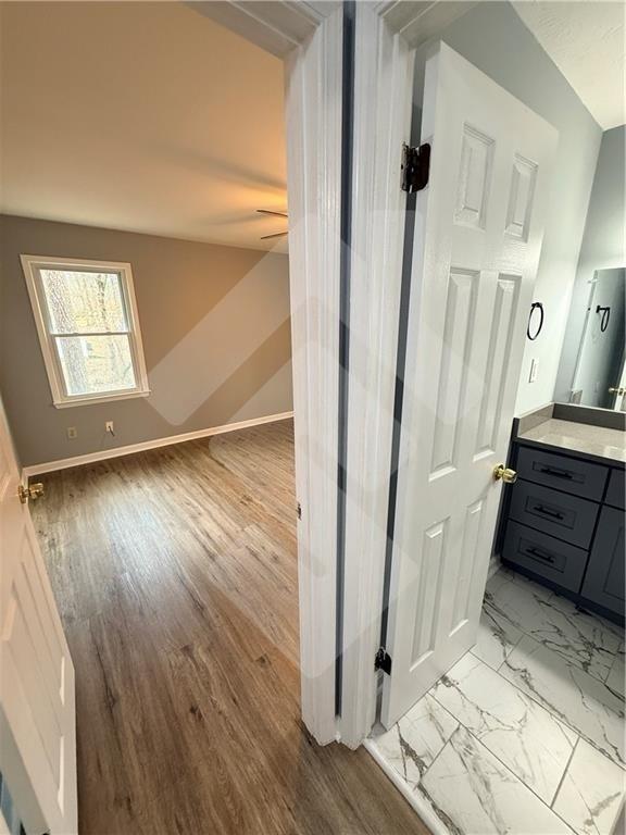 4502 Alder Lane Powder Springs, GA 30127 - Photo 24 of 64 a view of a hallway with wooden floor and staircase