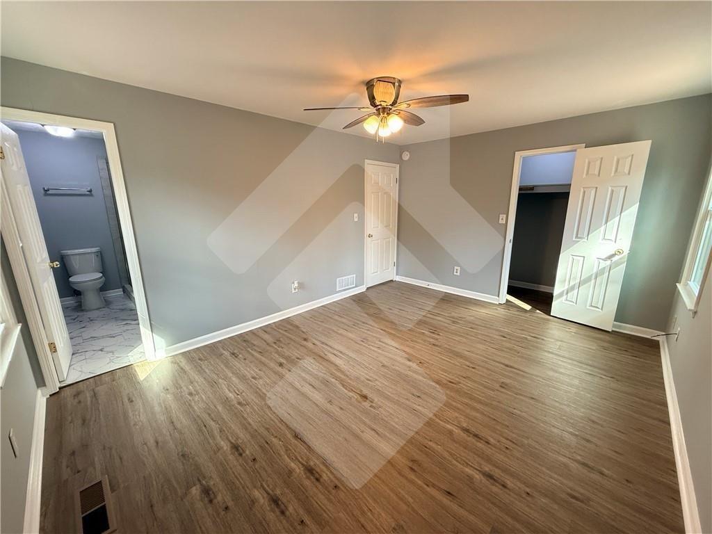 4502 Alder Lane Powder Springs, GA 30127 - Photo 29 of 64 a view of an empty room with wooden floor and a window