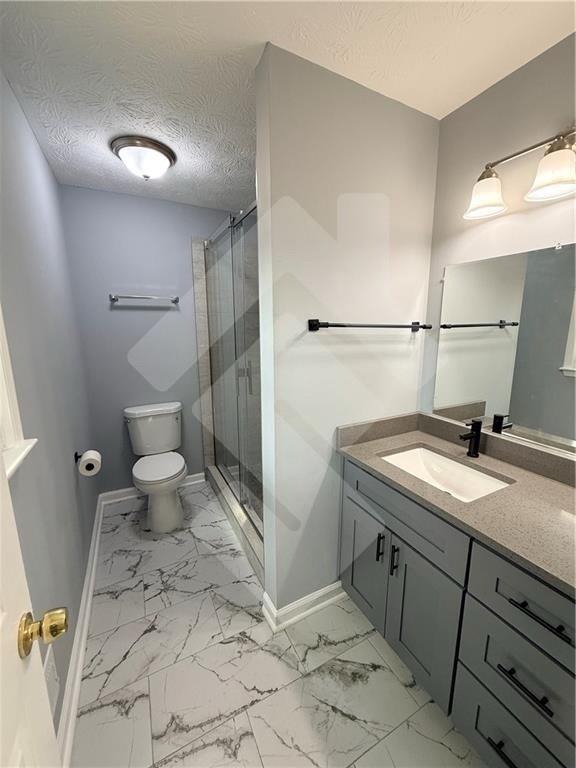 4502 Alder Lane Powder Springs, GA 30127 - Photo 30 of 64 a bathroom with a granite countertop sink toilet and shower