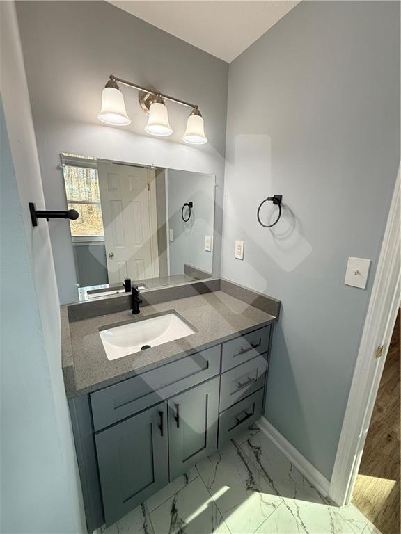 4502 Alder Lane Powder Springs, GA 30127 - Photo 32 of 64 a bathroom with a sink and a mirror