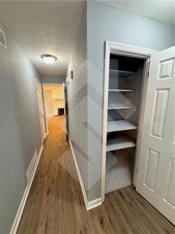 4502 Alder Lane Powder Springs, GA 30127 - Photo 34 of 64 a view of a hallway view with wooden floor and staircase