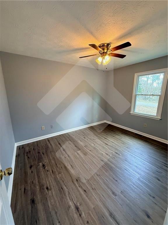4502 Alder Lane Powder Springs, GA 30127 - Photo 41 of 64 wooden floor in an empty room with a window