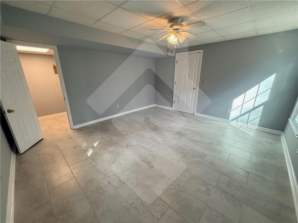4502 Alder Lane Powder Springs, GA 30127 - Photo 51 of 64 a view of an empty room with a fan