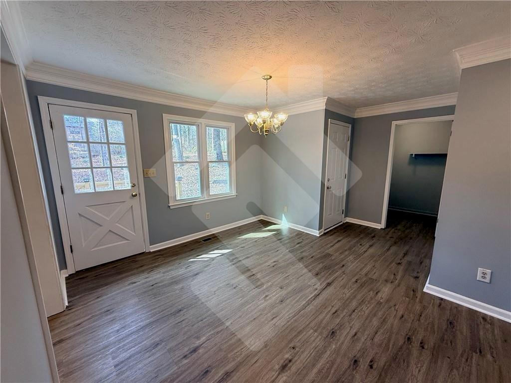 4502 Alder Lane Powder Springs, GA 30127 - Photo 7 of 64 an empty room with wooden floor and windows