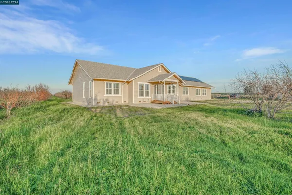 a view of a house with a big yard