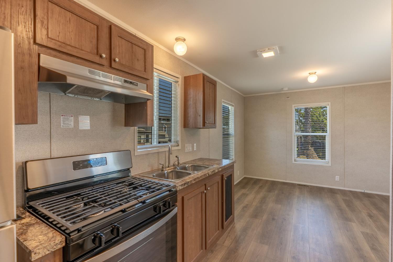 4610 Gateway Road, Unit 13 Bethel Island, CA 94511 - Photo 11 of 17 a stove top oven sitting inside of a kitchen