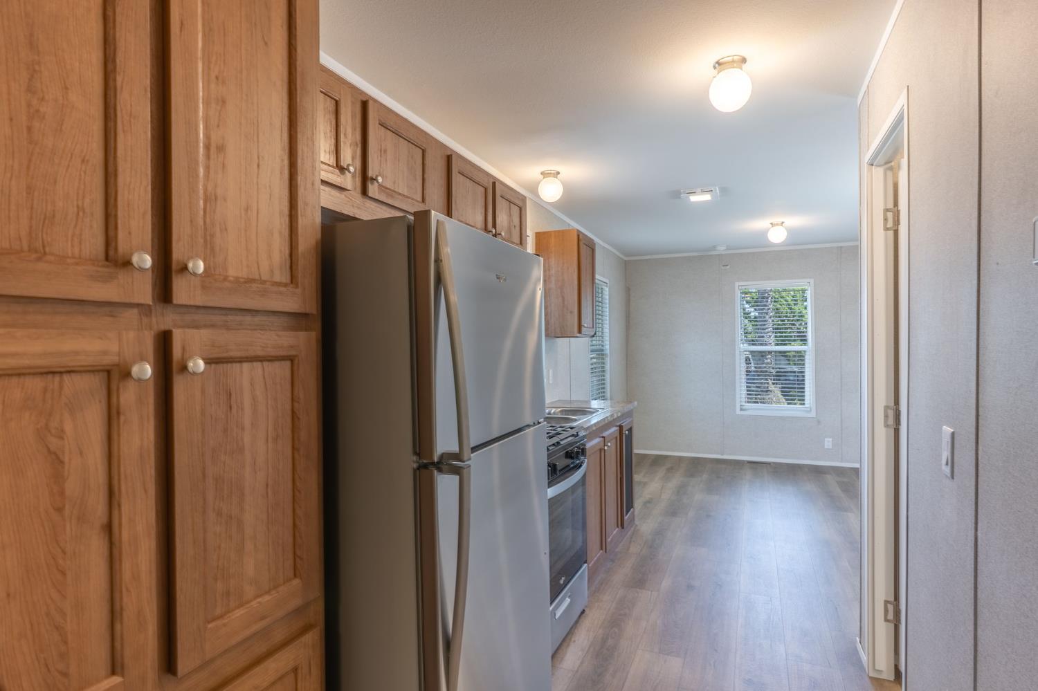 4610 Gateway Road, Unit 13 Bethel Island, CA 94511 - Photo 12 of 17 a view of kitchen with wooden floor and electronic appliances