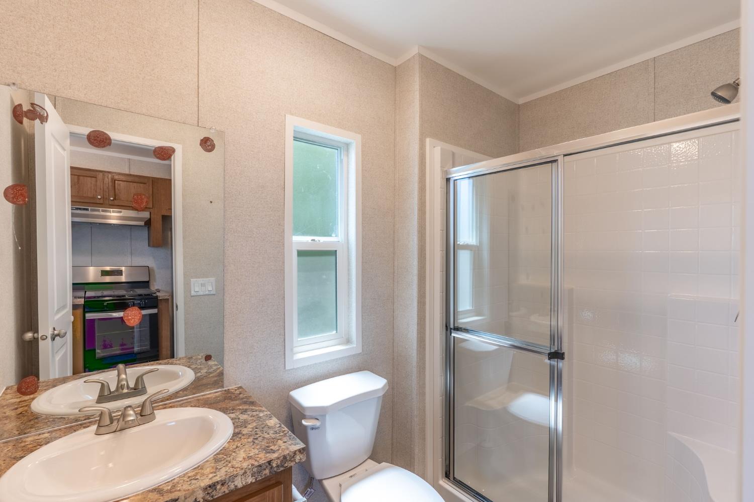 4610 Gateway Road, Unit 13 Bethel Island, CA 94511 - Photo 13 of 17 a bathroom with a sink toilet and shower