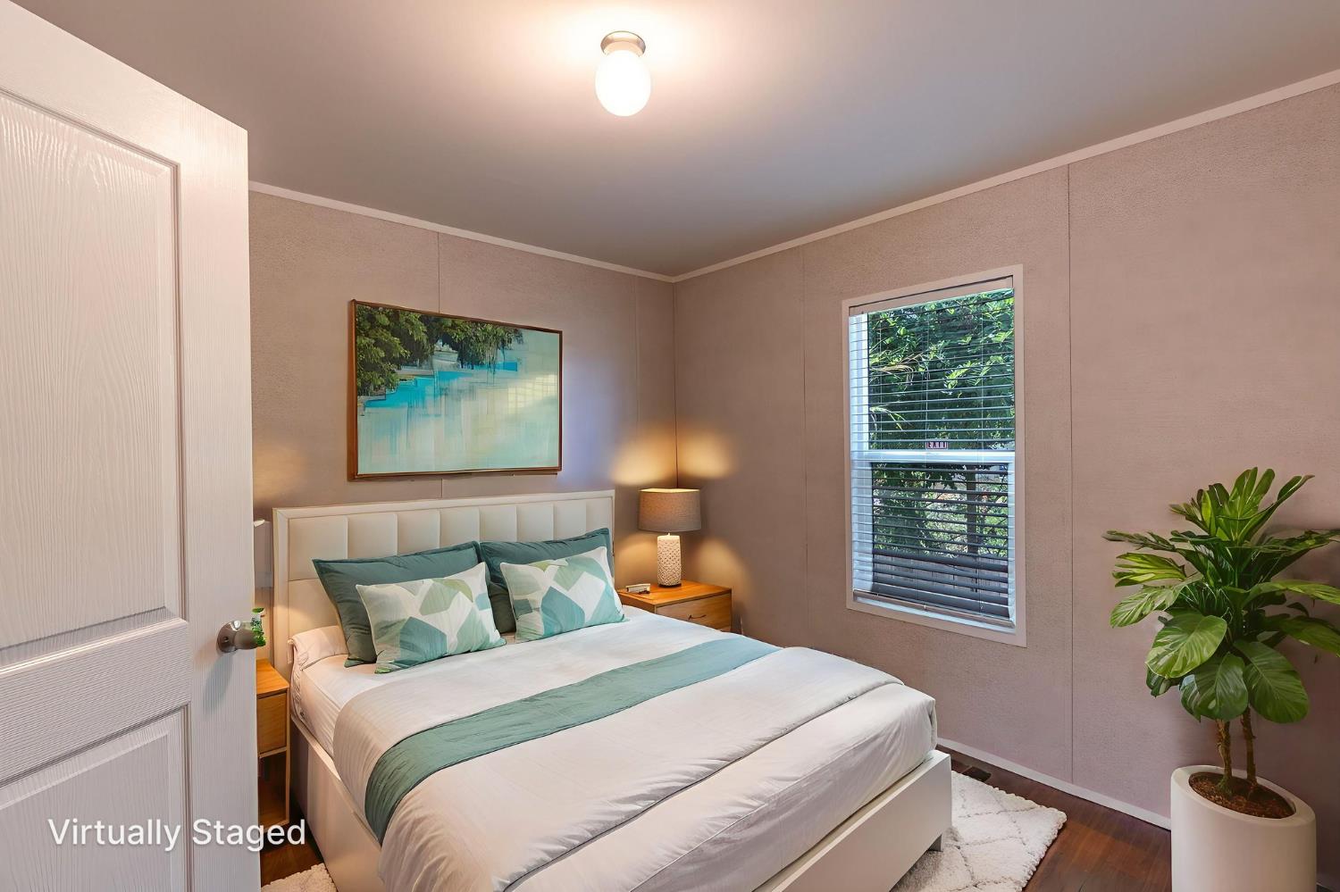 4610 Gateway Road, Unit 13 Bethel Island, CA 94511 - Photo 15 of 17 a bedroom with bed and a potted plant