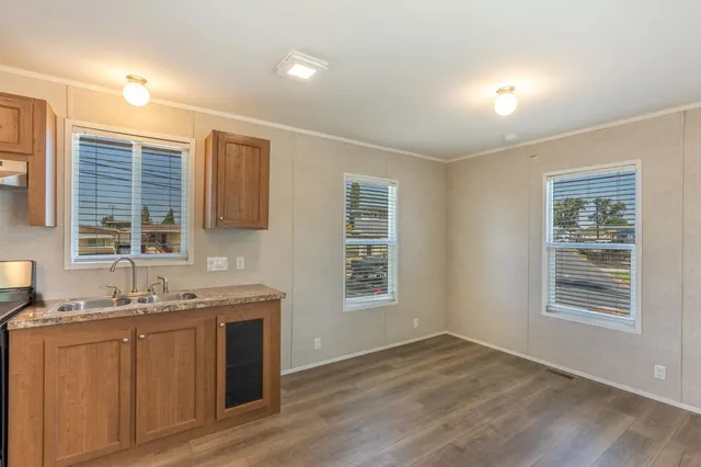 a view of a kitchen with windows