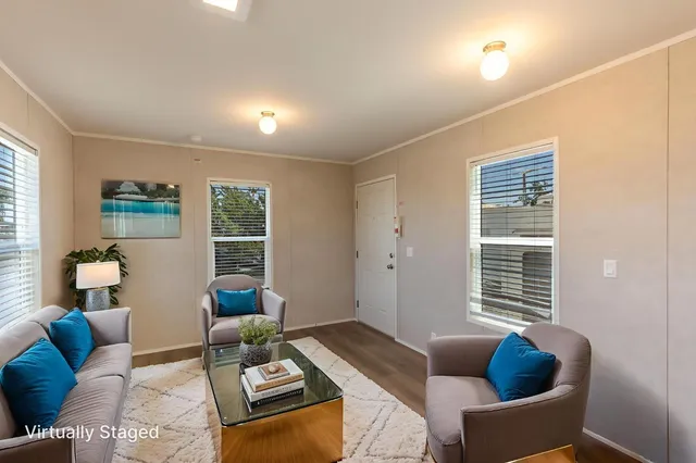 a living room with furniture and a window