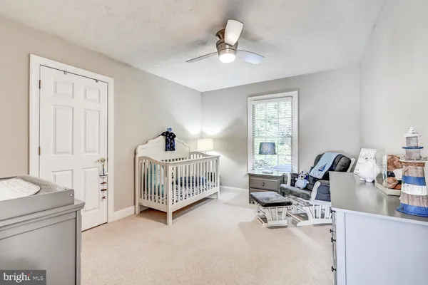 a bedroom with furniture and windows