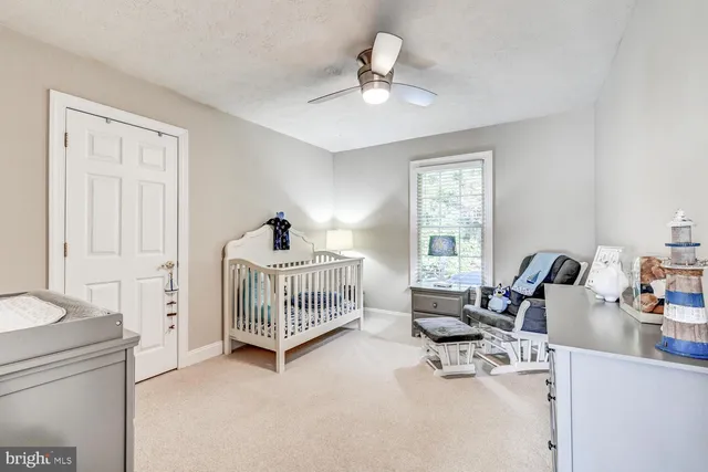 a bedroom with furniture and windows