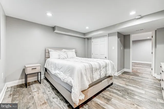 a bed room with a bed and a chair