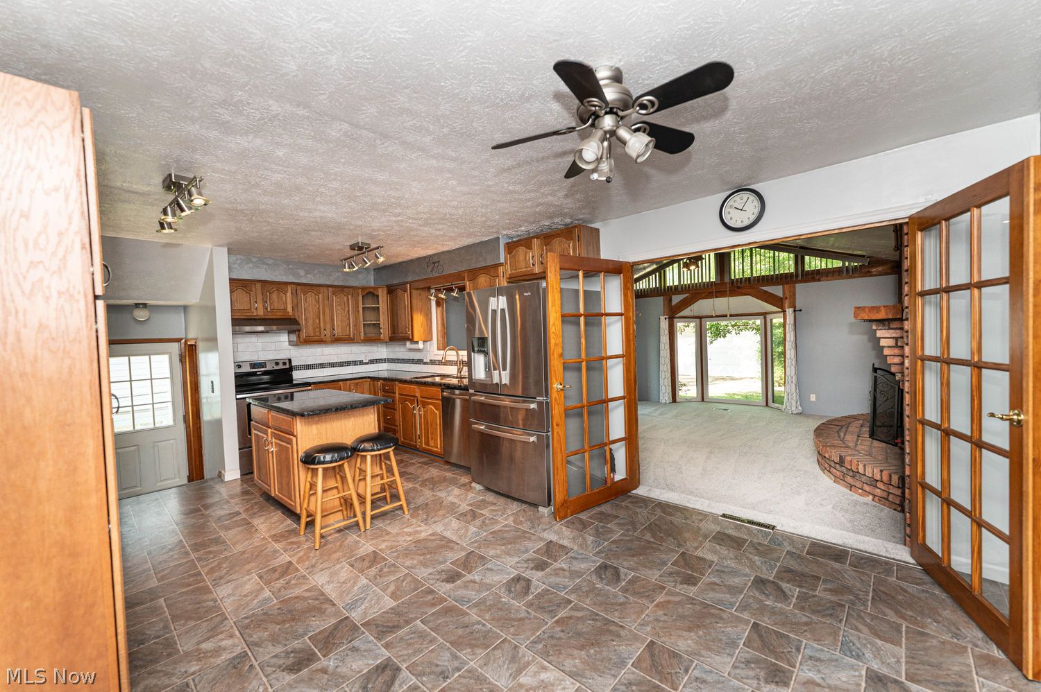 916 Center Road Eastlake, OH 44095 - Photo 10 of 39 Eat-in kitchen with vinyl flooring and french doors opening to the enormous and fantastic great room