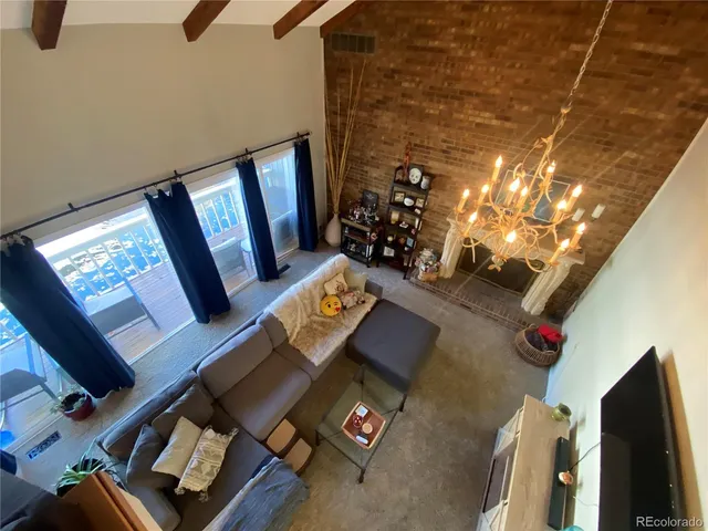 a view of living room with furniture and a flat screen tv