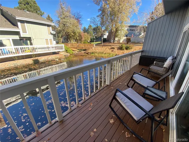 a view of a balcony with wooden floor