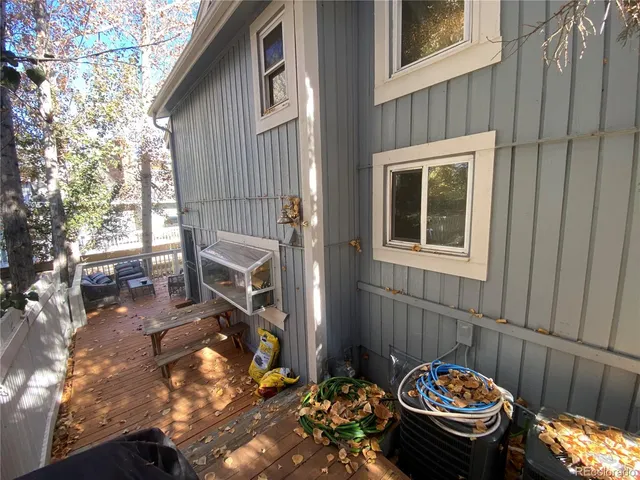 a balcony with table and chairs