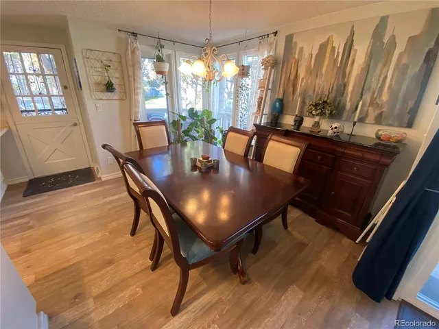 a view of a dining room with furniture and window