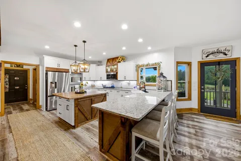 a kitchen with counter top space cabinets and stainless steel appliances