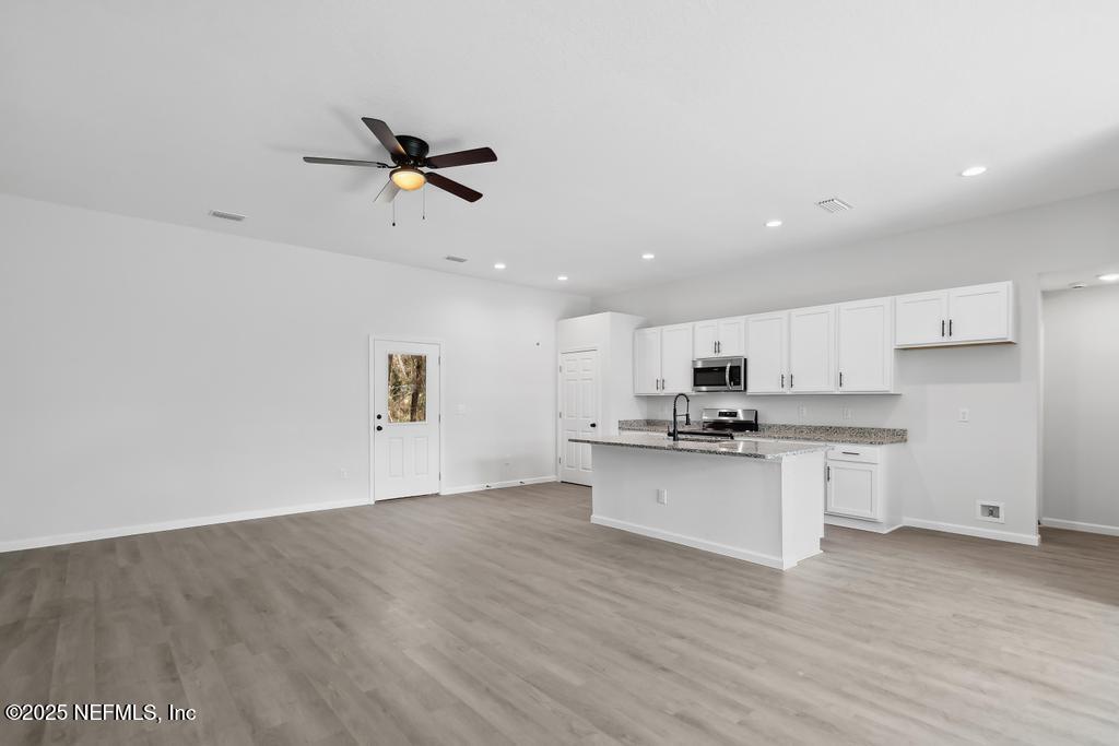 80 Bird Road Jacksonville, FL 32218 - Photo 8 of 36 Luxury Vinyl Plank Throughout