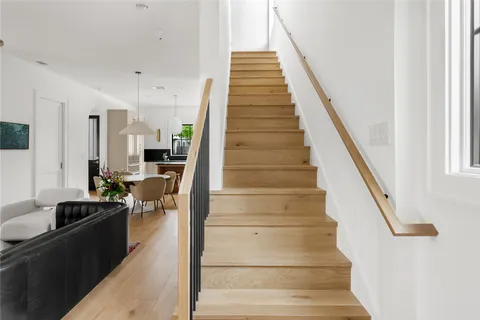 a view of entryway and hall with wooden floor