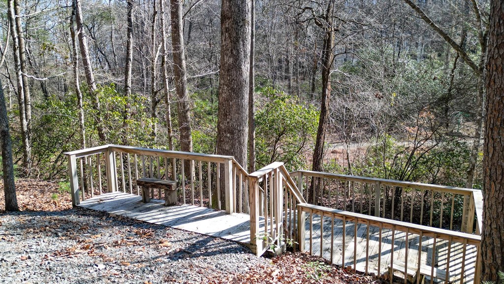 57 Mangum's Trail Blue Ridge, GA 30513 - Photo 58 of 66 a view of balcony with wooden fence and trees