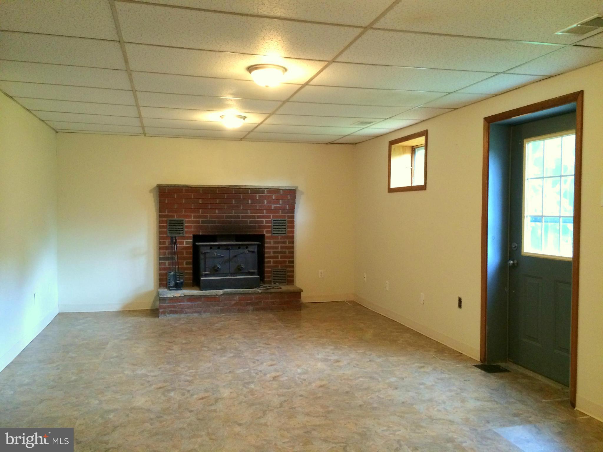 3599 Guard Hill Road Front Royal, VA 22630 - Photo 20 of 30 Family Rm w/ Wood Fireplace & Walk-Out to Backyard