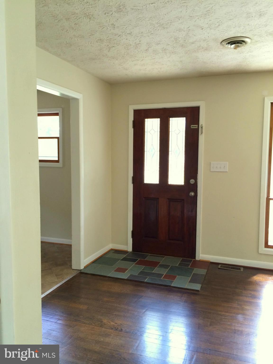 Living Room View #5, with gorgeous wood Front Door