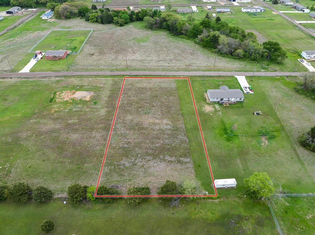 Birds eye view of property featuring a rural view