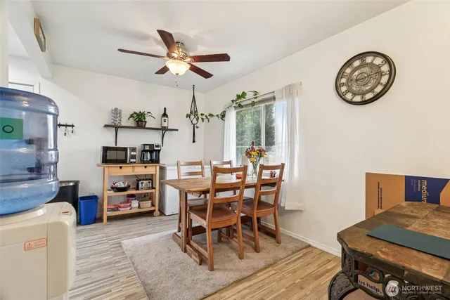 a view of a dining room with furniture and a chandelier