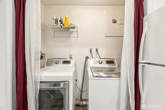 a kitchen with a stove top oven sink and refrigerator