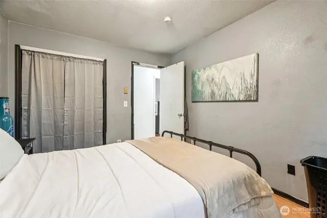 a bedroom with furniture and a gym equipment