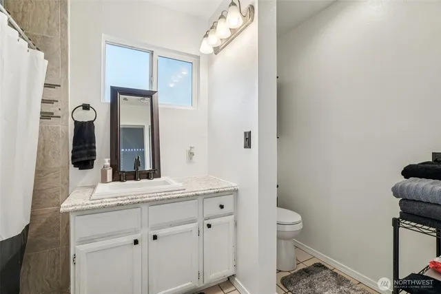 a view of deck with chairs and wooden fence