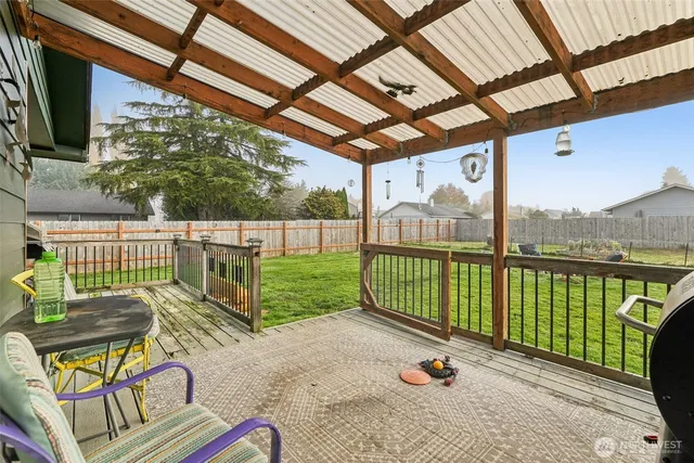 a view of a chair and tables in the balcony