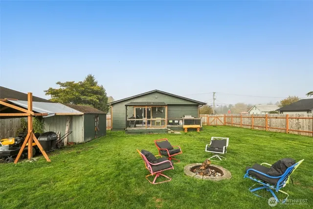 a view of swimming pool with table and chairs