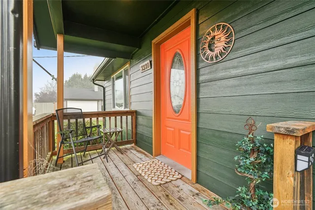 a view of front door with wooden floor