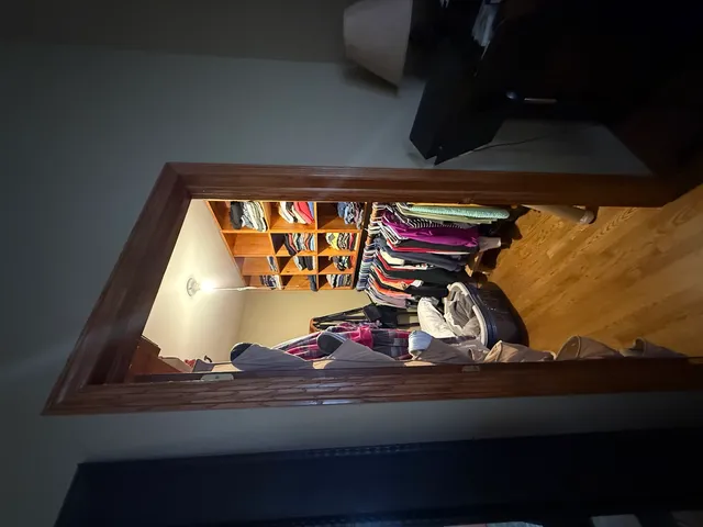 a bathroom with a sink mirror vanity and toilet