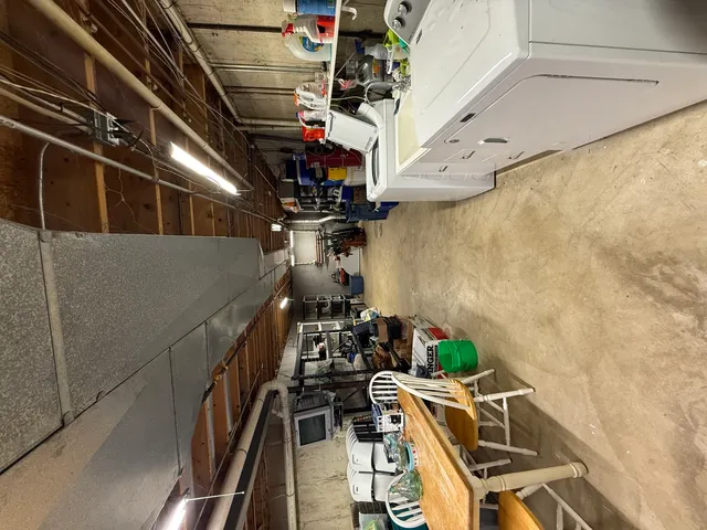 a view of living room with furniture and entryway