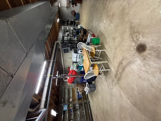 a view of a deck with chairs and wooden floor