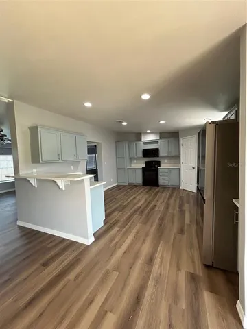 a view of kitchen with wooden floor