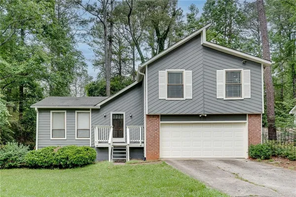 a view of a yard in front view of a house
