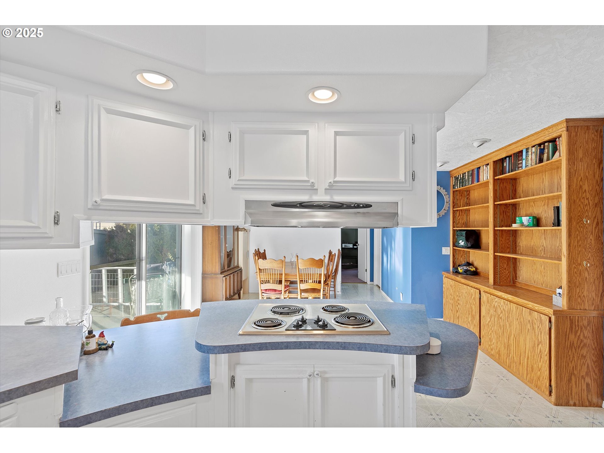 2901 East 2nd Street, Unit 84 Newberg, OR 97132 - Photo 11 of 30 a kitchen with stainless steel appliances wooden floor and a refrigerator