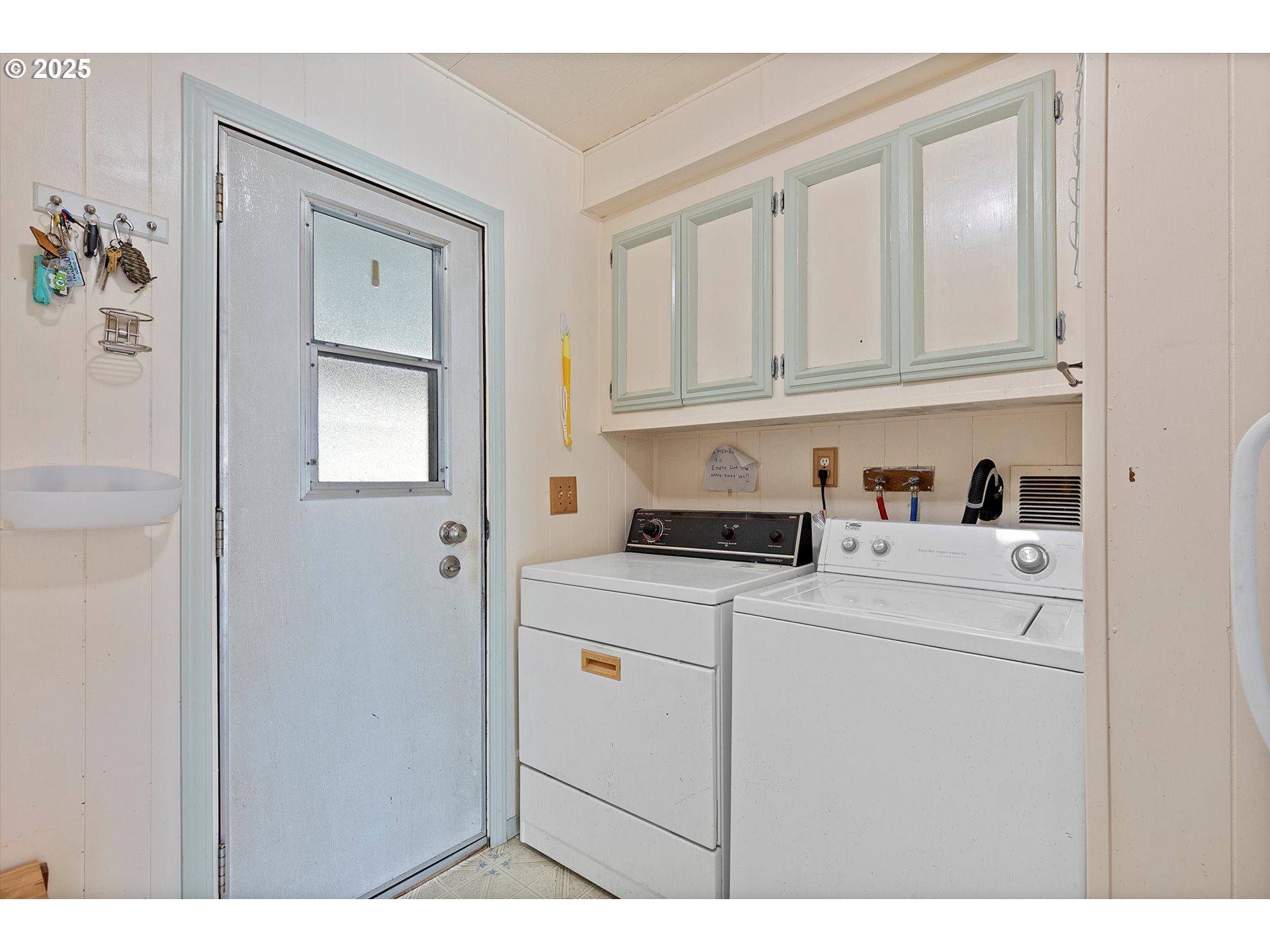 2901 East 2nd Street, Unit 84 Newberg, OR 97132 - Photo 20 of 30 a kitchen with white cabinets and sink