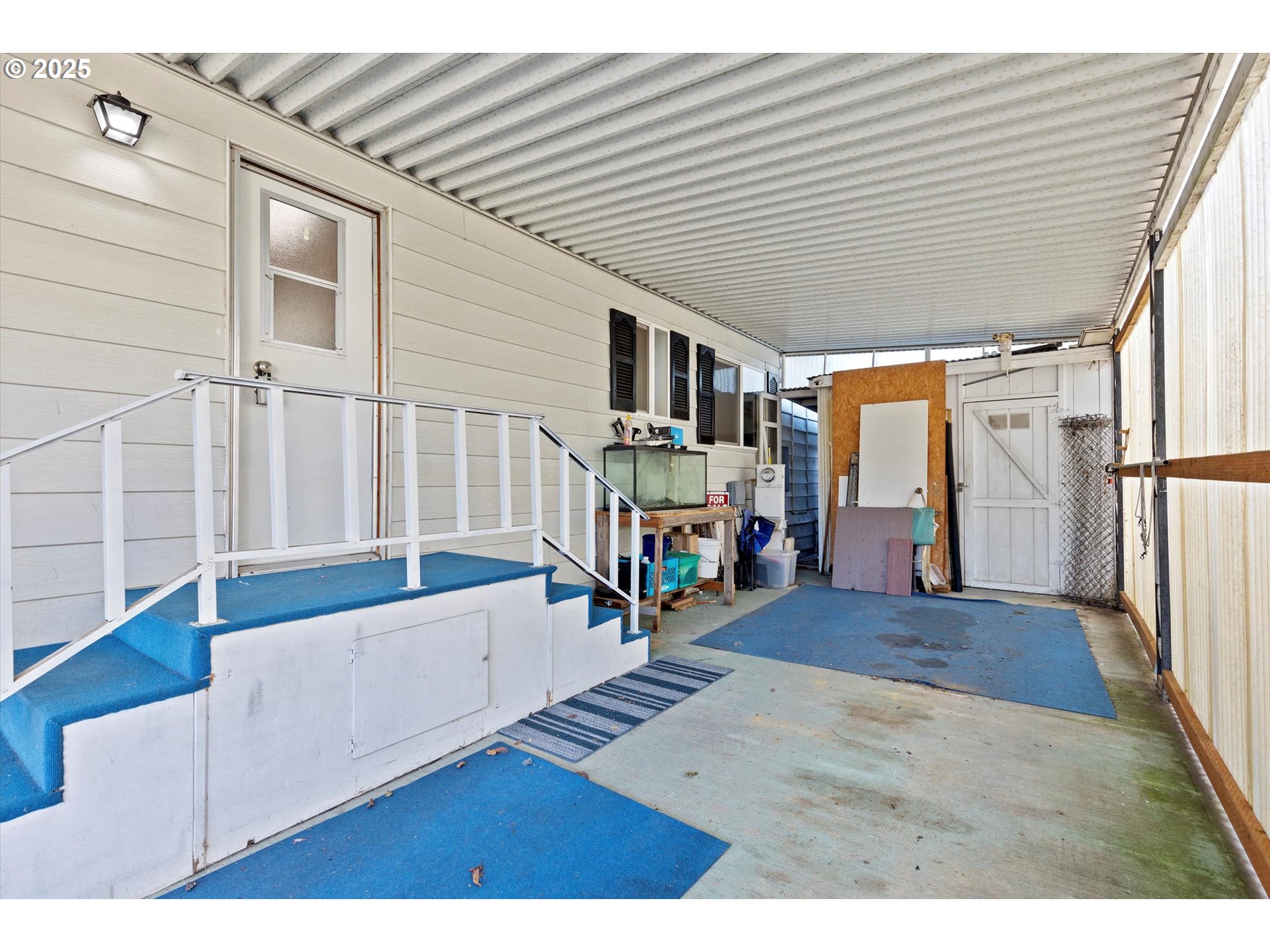 2901 East 2nd Street, Unit 84 Newberg, OR 97132 - Photo 29 of 30 a living room with furniture and a wooden floor