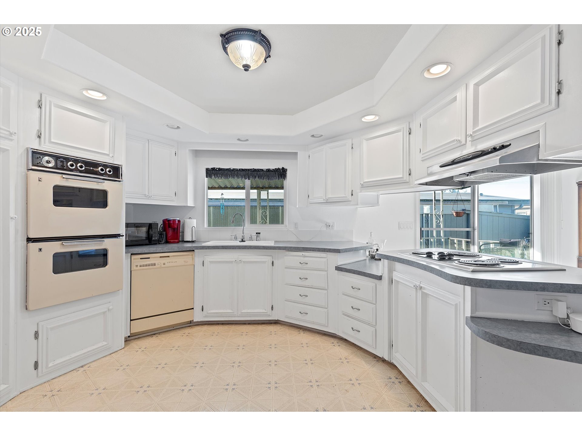 2901 East 2nd Street, Unit 84 Newberg, OR 97132 - Photo 9 of 30 a kitchen with granite countertop a sink stainless steel appliances and cabinets