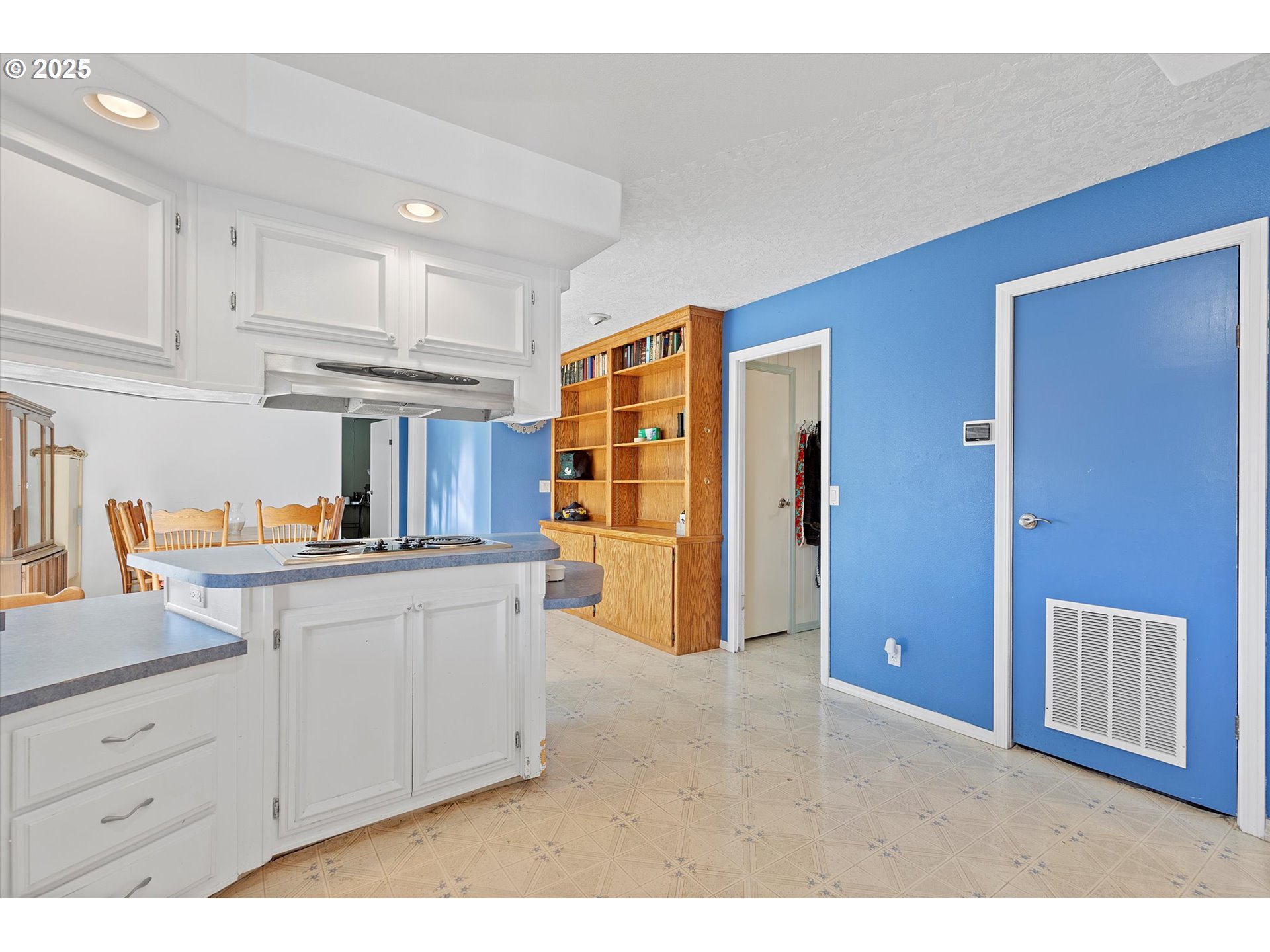 2901 East 2nd Street, Unit 84 Newberg, OR 97132 - Photo 10 of 30 a kitchen with granite countertop a refrigerator and cabinets