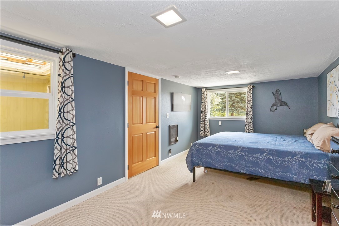 3604 Madrona Street Bremerton, WA 98312 - Photo 15 of 37 a bedroom with a bed and a window