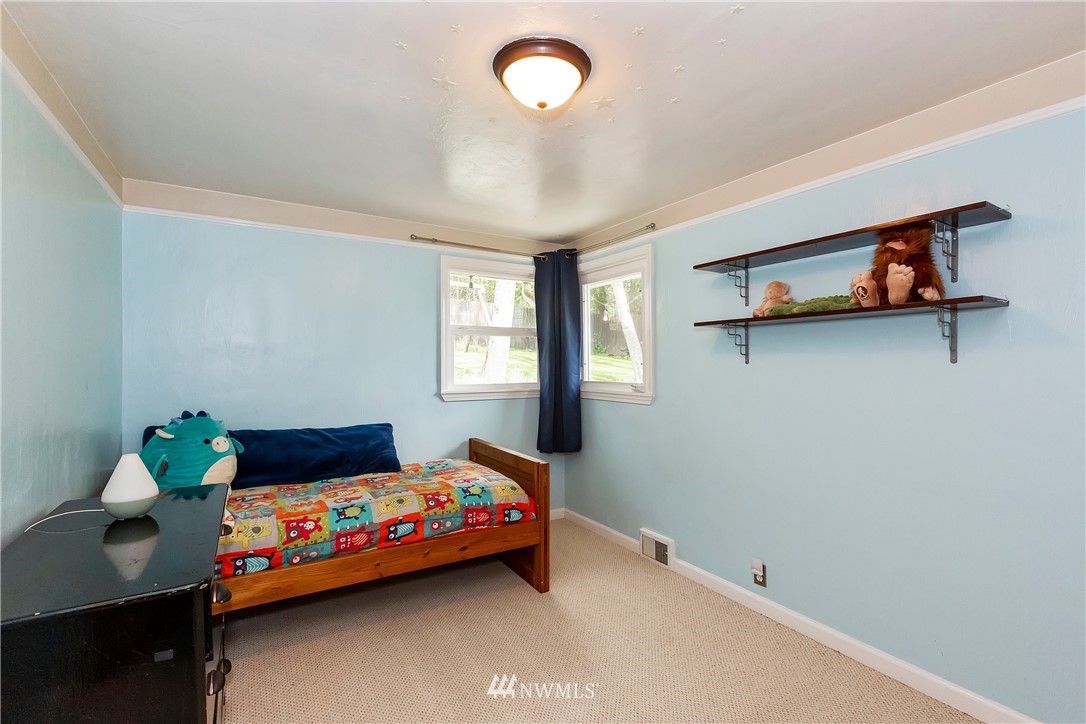 3604 Madrona Street Bremerton, WA 98312 - Photo 17 of 37 a bedroom with a bed and window